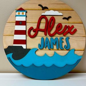 Can do any name. Custom made 18” diameter wooden baby name sign